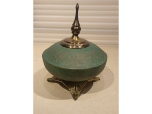 Green Display With Golden Base